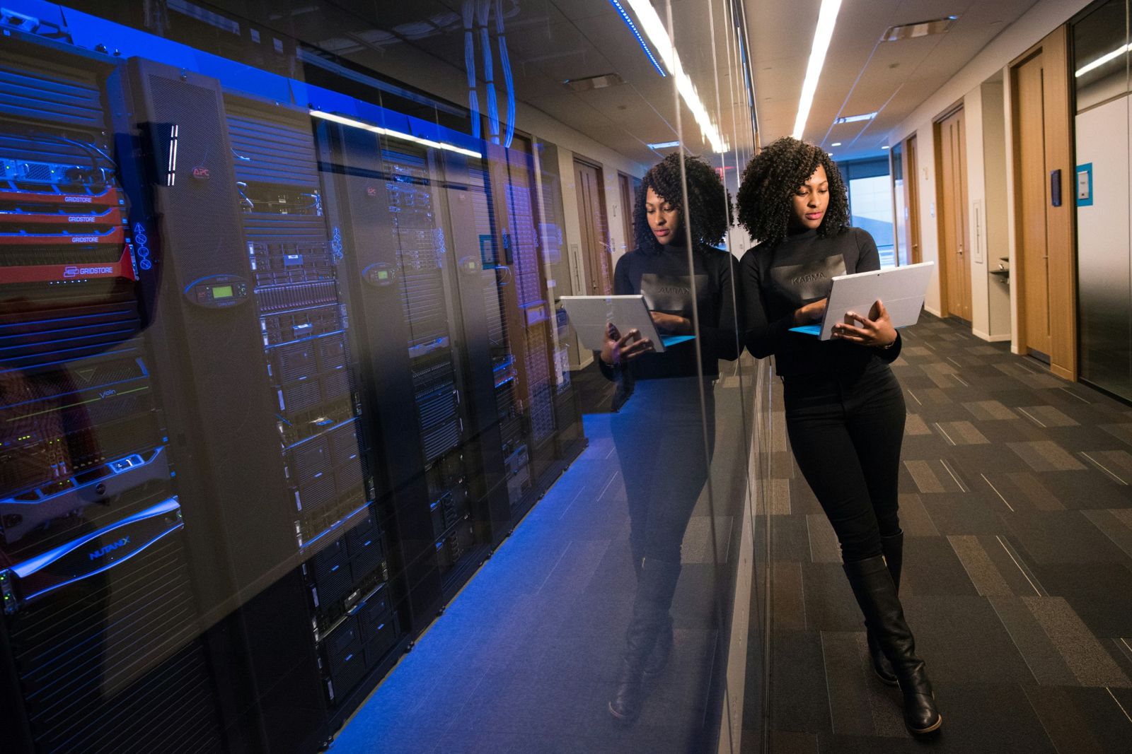 Engineer in data center hallway