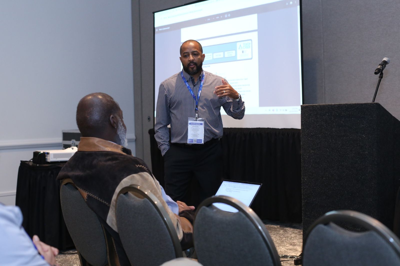 Instructor speaking at a tech workshop