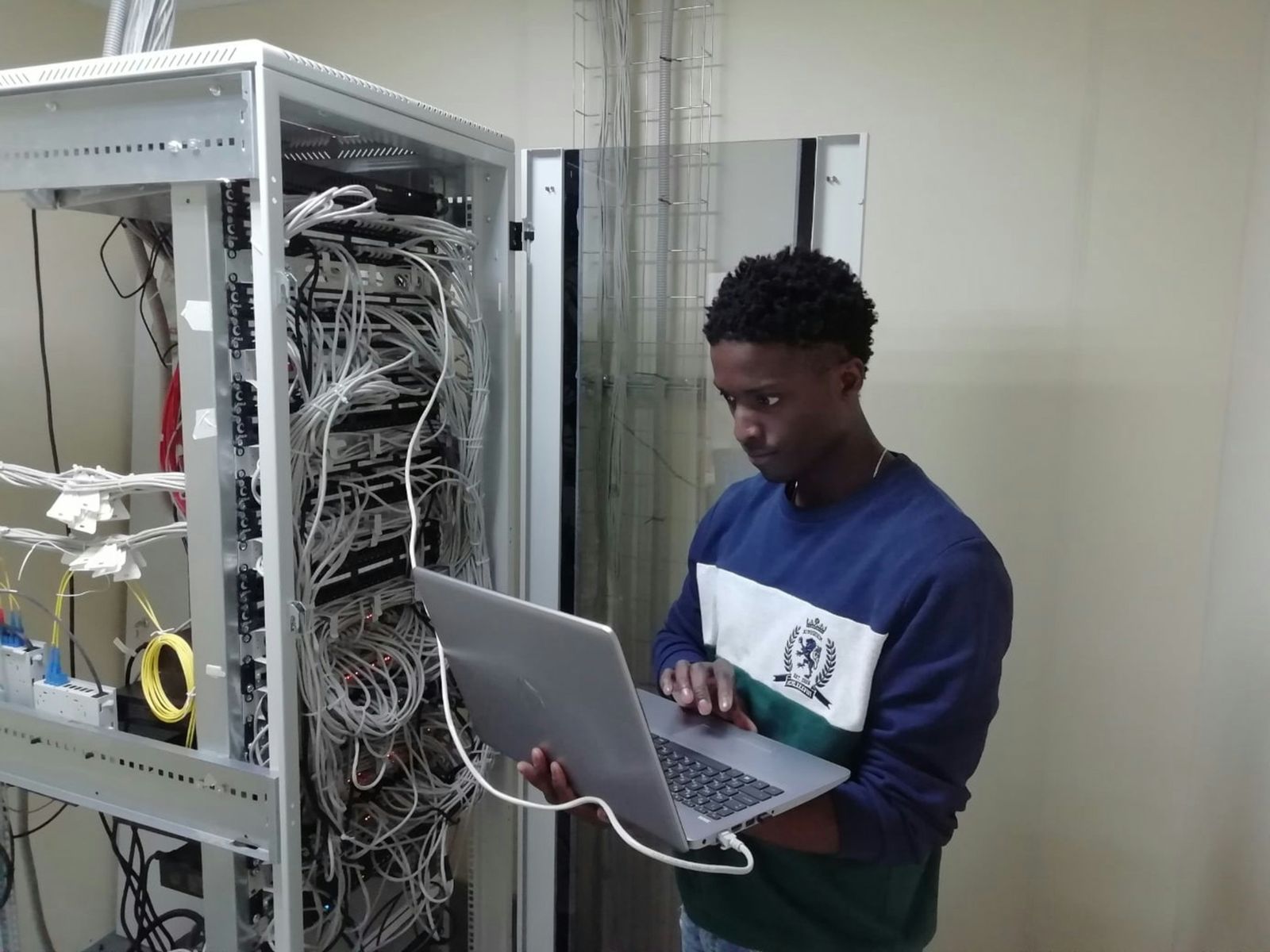 Technician working on network rack